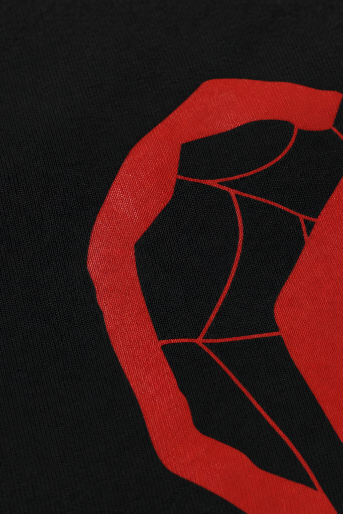 Close-up fabric detail - Voyd Red Spiral Black T-shirt